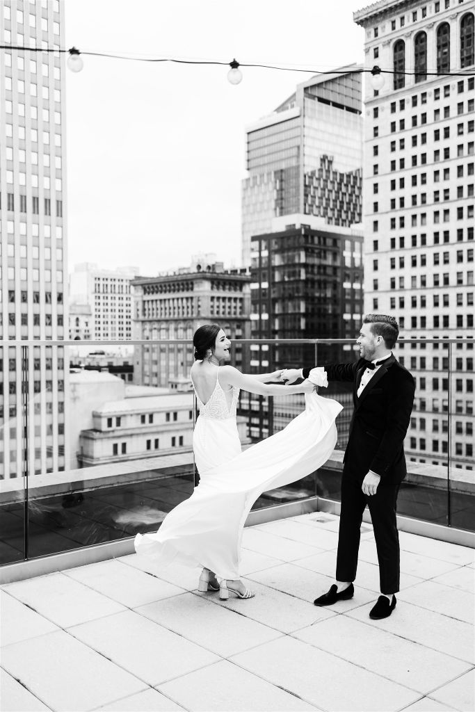 Groom spins bride as she shows off her dress
