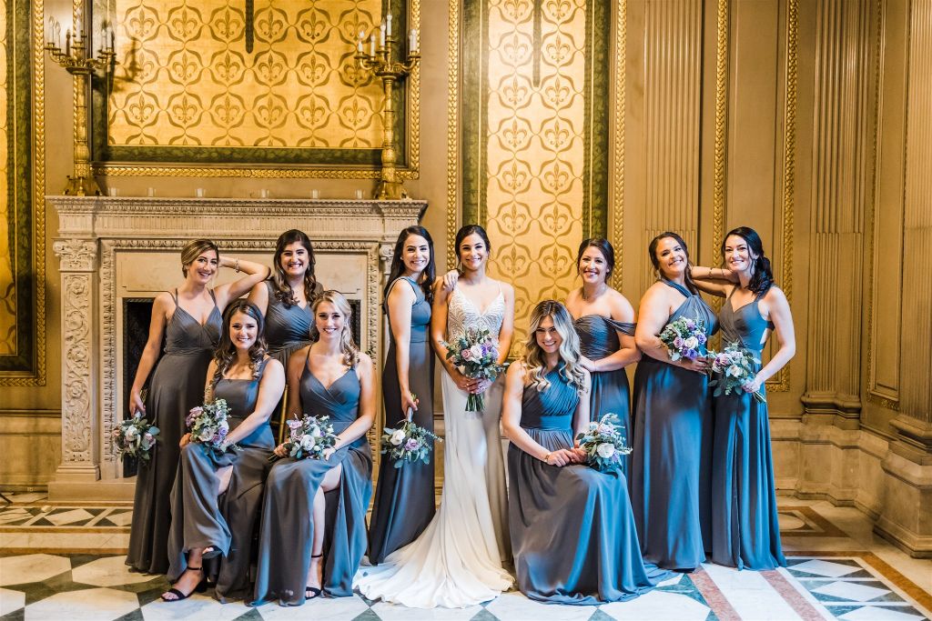 Bride and bridesmaids pose together at Carnegie Museum 