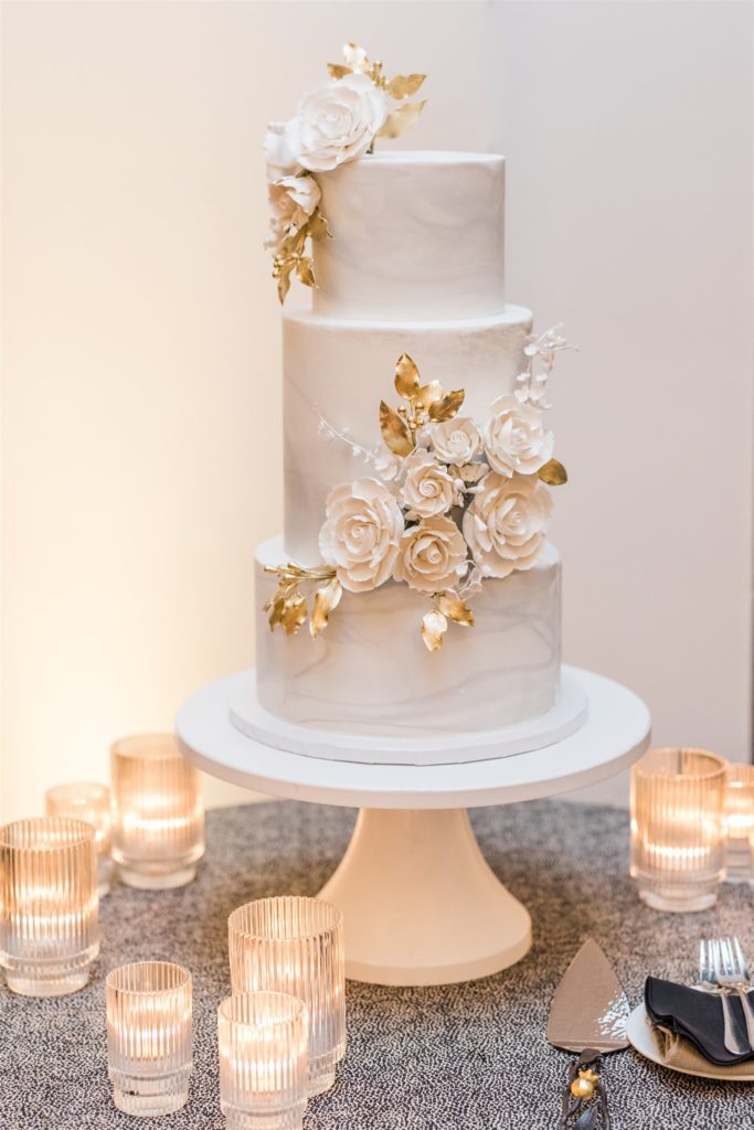 White and gold wedding cake at Wedding at Hotel Monaco