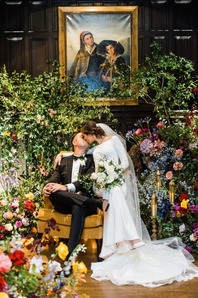 Bride and groom kiss inside their  Mansions on Fifth wedding