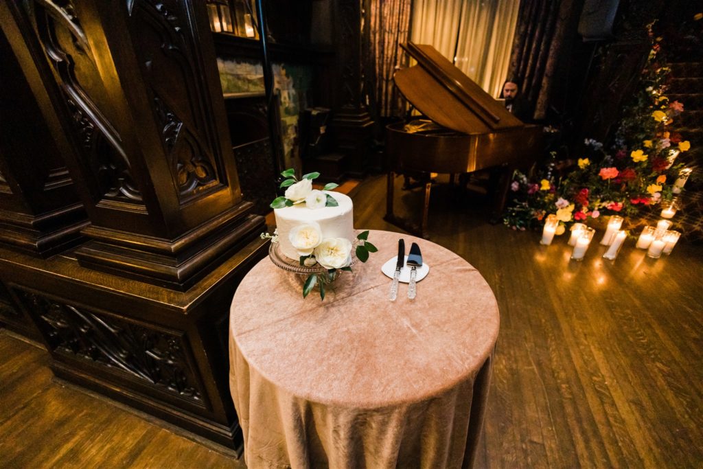 Simple wedding cake inside mansion