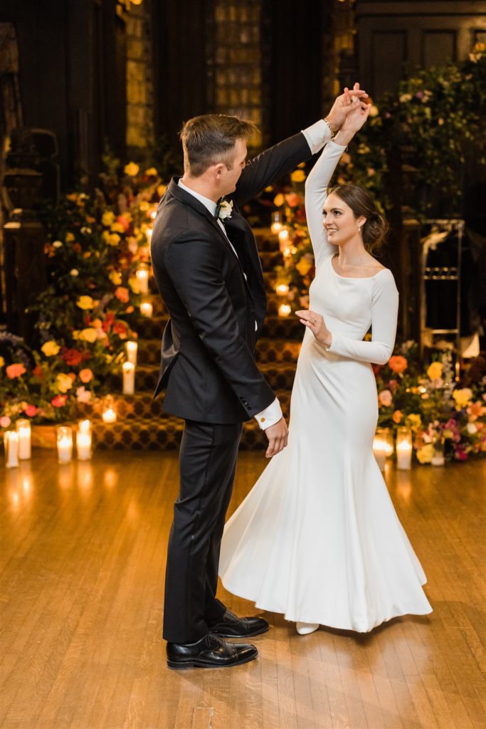 Groom spins bride during first dance at Mansions at Fifth reception