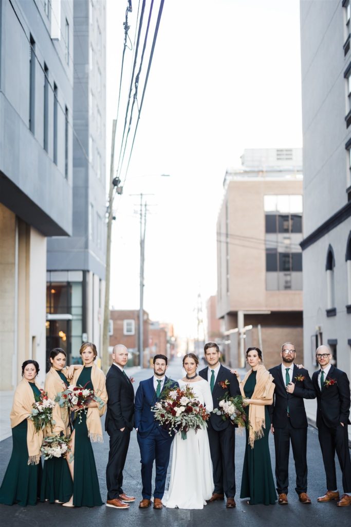 Bridal party poses in State College back alley