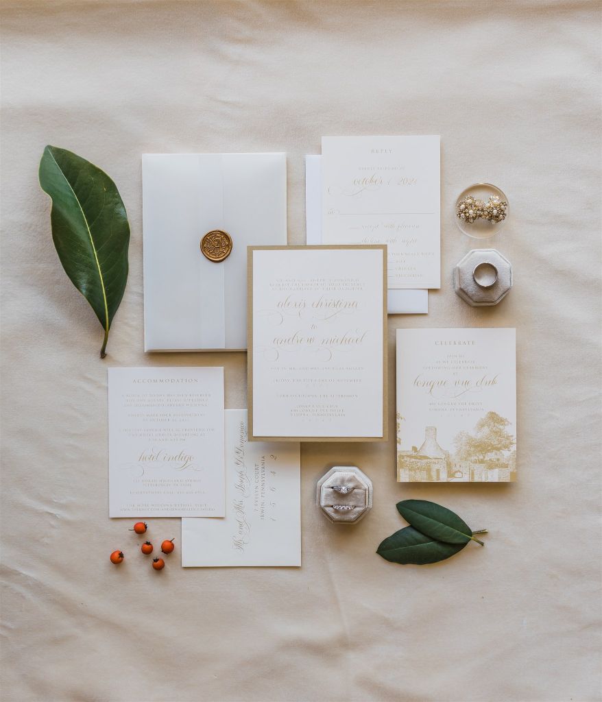 White, ivory and green stationery flat lay