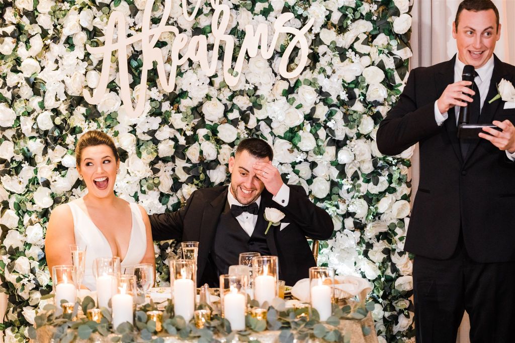 Bride and groom react as best man gives wedding speech