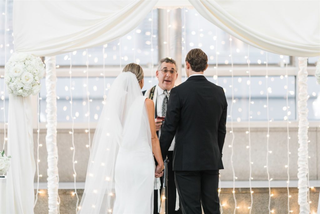 Bride and groom say their vows at Black and White PPG Wedding