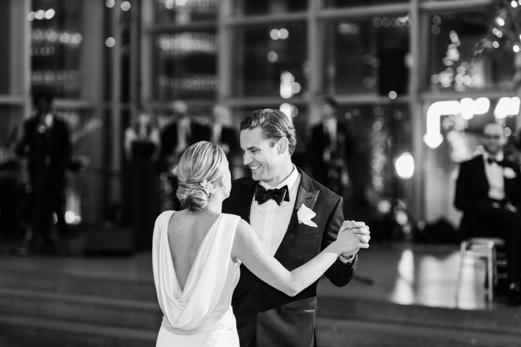 Bride and groom share first dance at black and white PPG wedding