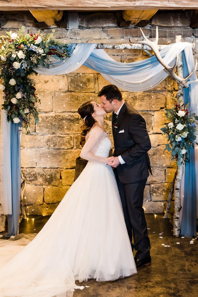Bride and groom share first kiss as man and wife