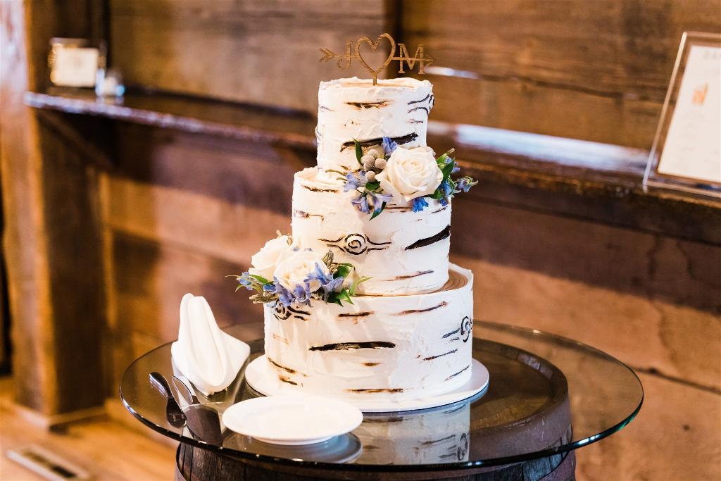 Oakmont bakery cake that is white and brown with white florals