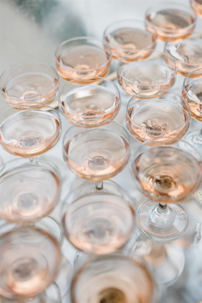 Champagne glasses with light pink champagne