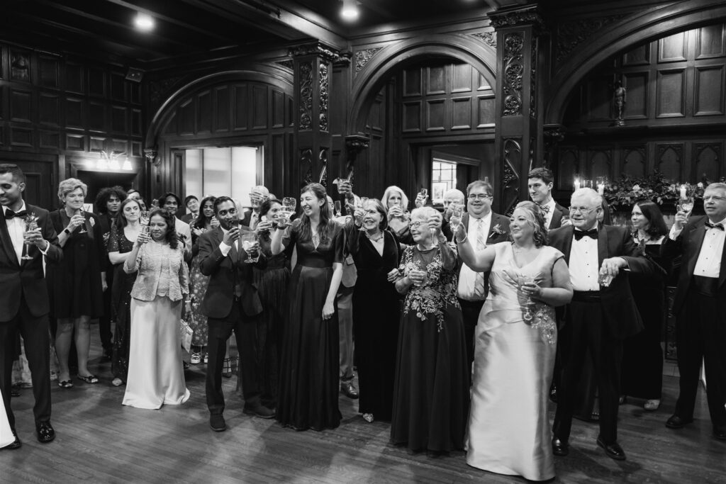 Guests toast at Winter Wedding at the Mansions on Fifth
