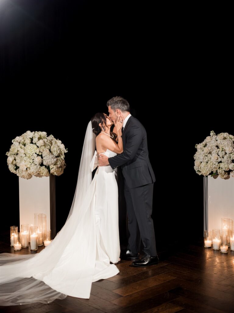 Elegant summer wedding ceremony setup at Hotel Monaco with floral arrangements